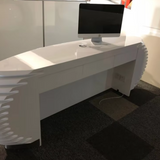 LuxuraFlair: Glossy Black Bamboo Fluted Reception Desk with Velvet Accents