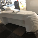 LuxuraFlair: Glossy Black Bamboo Fluted Reception Desk with Velvet Accents